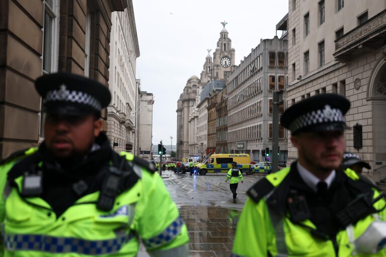 NPR News: 27 hospitalized, including 4 children, after car plows into Liverpool FC parade
